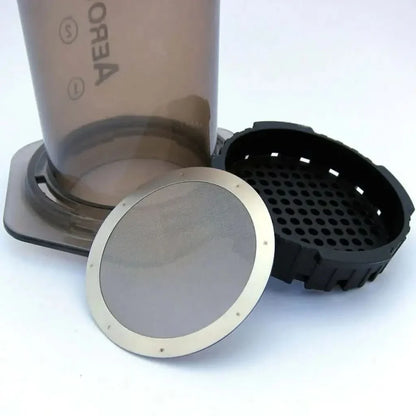 Disassembled Aeropress coffee maker.
