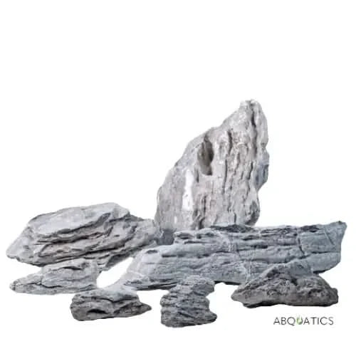 Collection of gray, layered rocks.