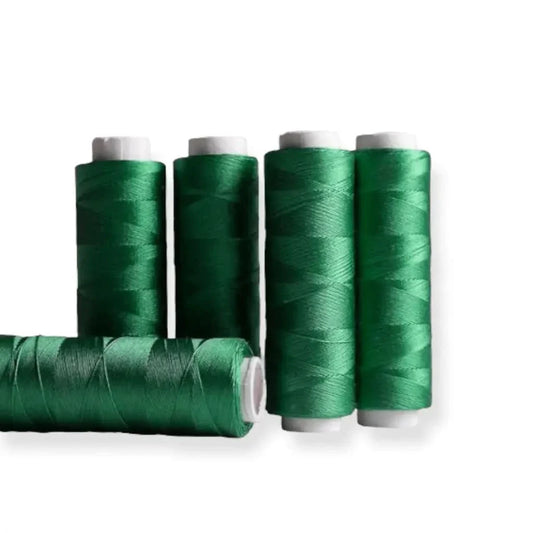 Emerald green spools of thread.