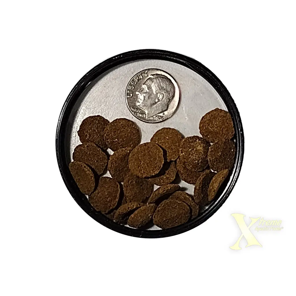 Round brown fish food pellets.