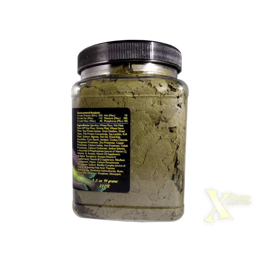 Container of green fish food flakes.