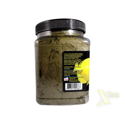 Container of green fish food flakes.